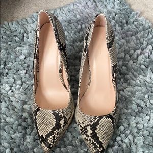 Black and cream heels runs big